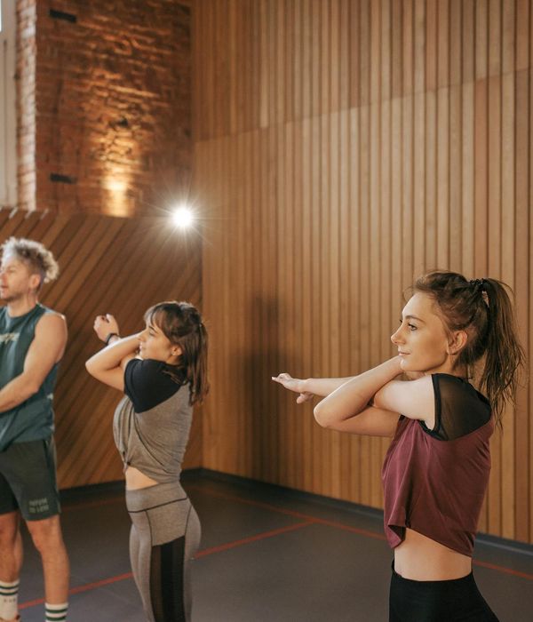 A group of people enjoying a calm and balanced workout session together.